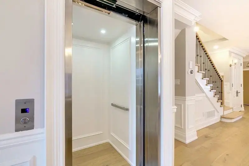 Elite Plus residential elevator installation in a Florida home with bright interior and stainless steel entrance