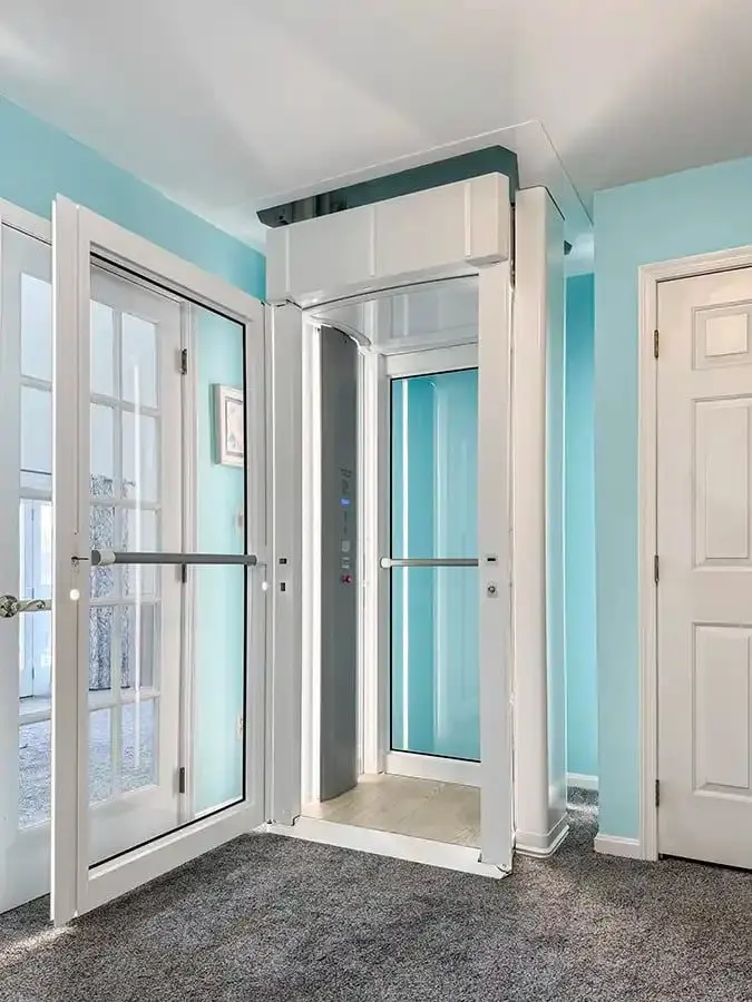 Elegant Savaria Luma Lift through-floor home lift with open door and white finish in a Florida residence