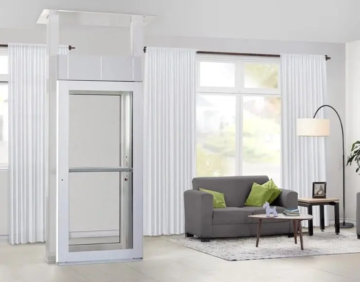 Space-saving Savaria Luma Lift home elevator with white frame installed in a contemporary Florida residence