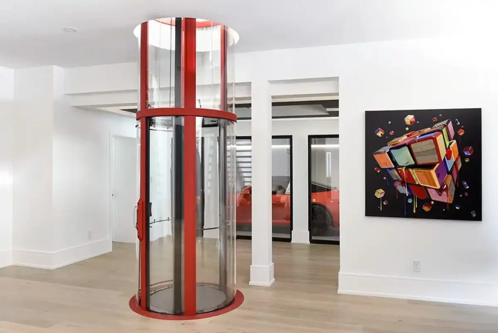 Custom red Savaria VueLift Mini home elevator with panoramic enclosure in a modern Florida residence