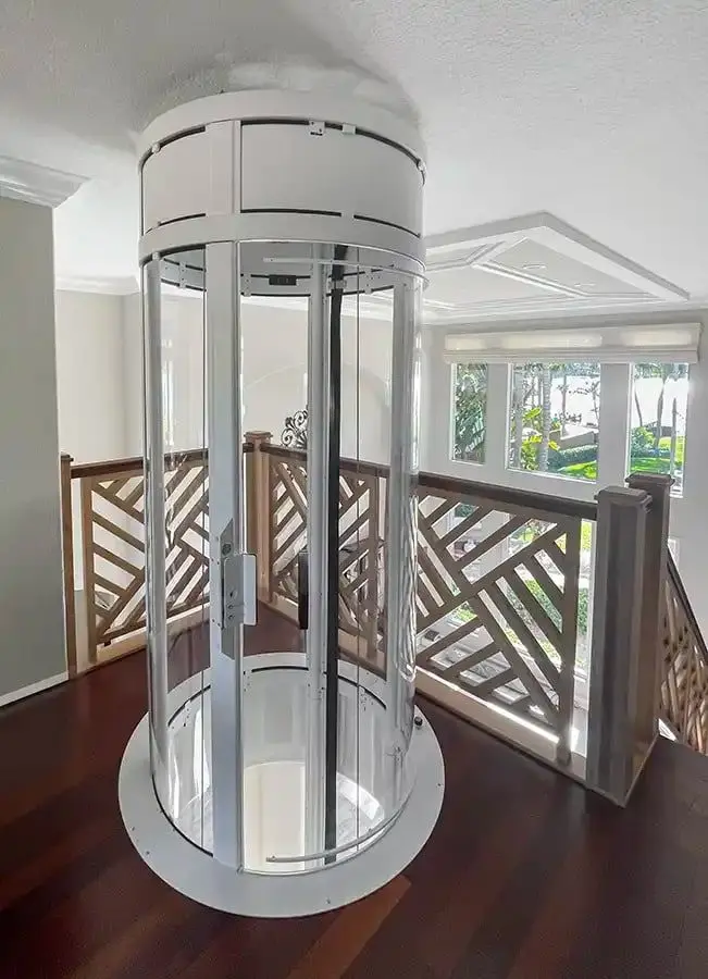 Savaria VueLift Mini home elevator with clear panoramic enclosure installed in a Florida residence