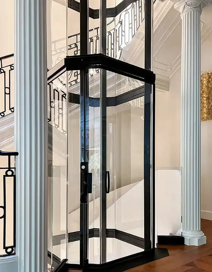 Savaria VueLift octagonal acrylic residential elevator installed in a luxury Florida home