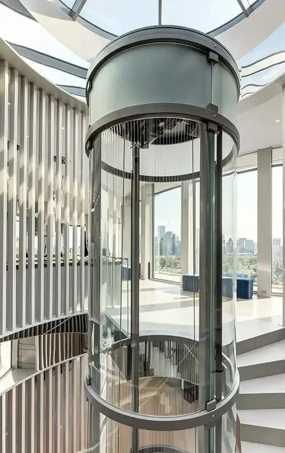 Savaria VueLift round glass residential elevator installed in a modern luxury home in Florida